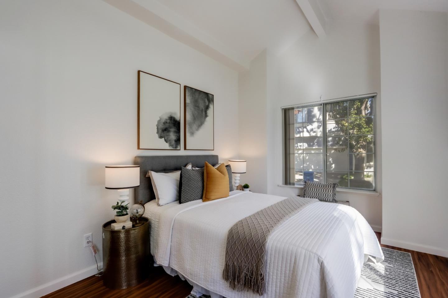 2373 Homestead Road Santa Clara, CA 95050 - Photo 21 of 30 a bedroom with a bed and a painting on the wall