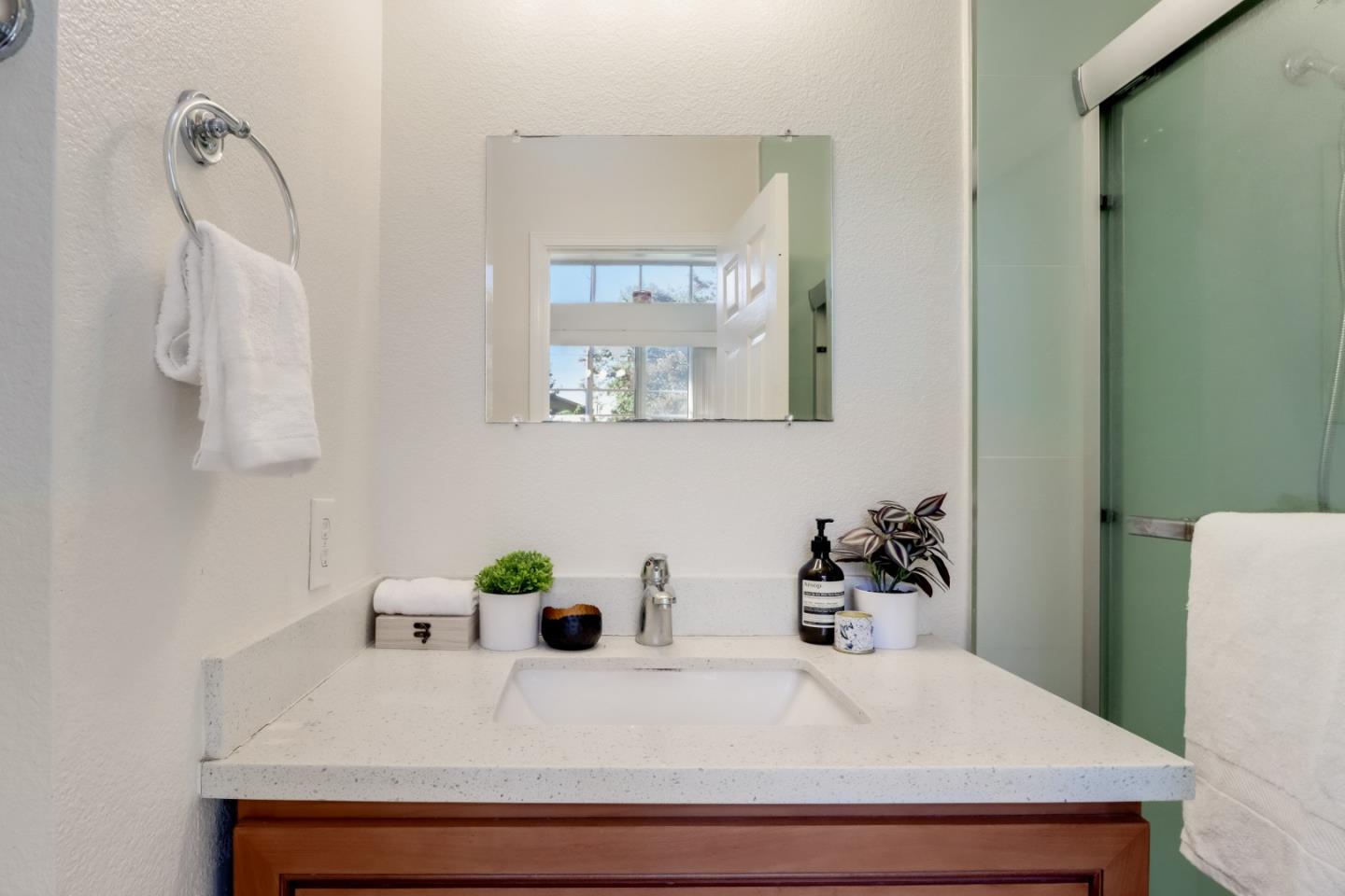2373 Homestead Road Santa Clara, CA 95050 - Photo 23 of 30 a bathroom with a sink a mirror and vanity