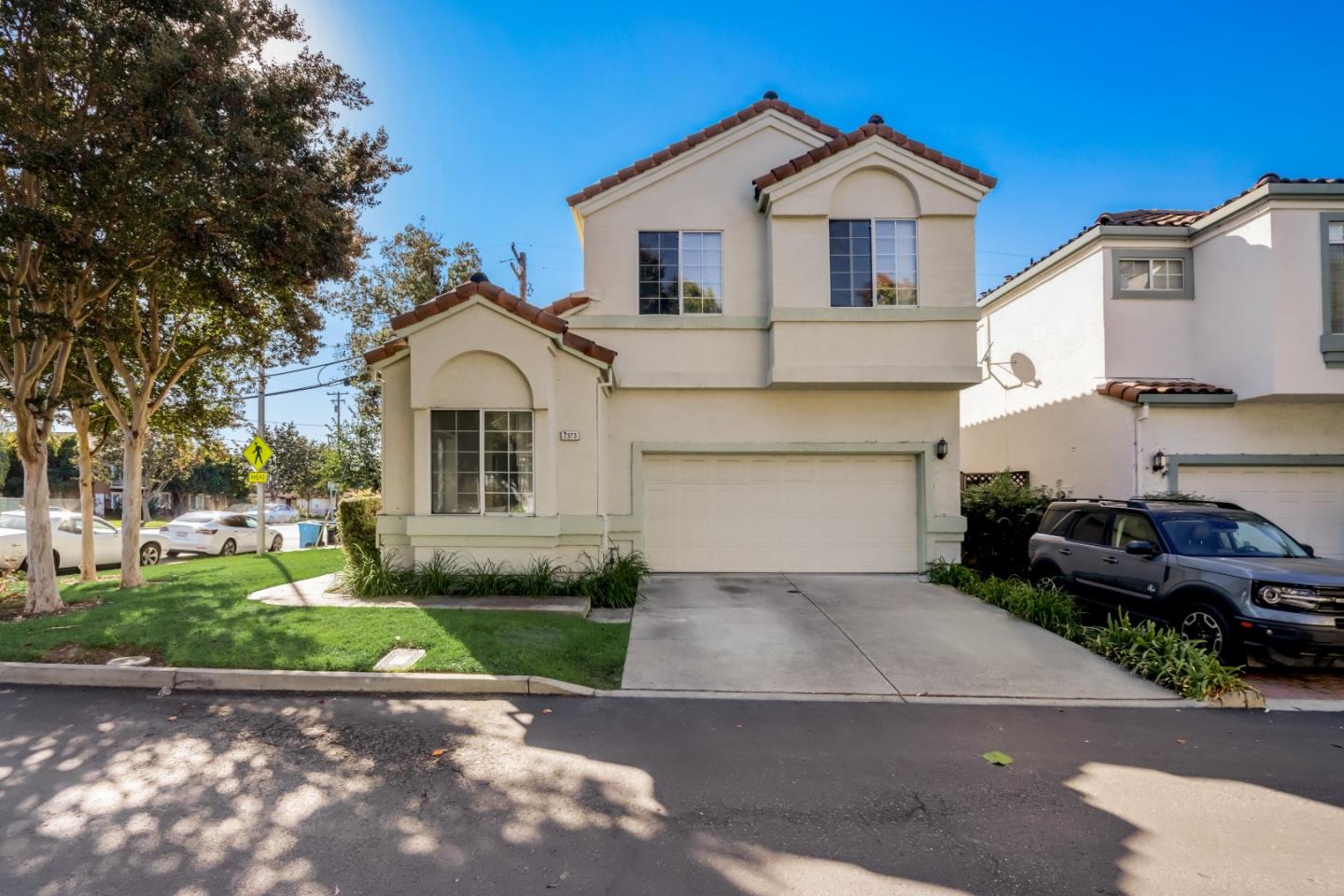 2373 Homestead Road Santa Clara, CA 95050 - Photo 24 of 30 a front view of a house with a yard and garage
