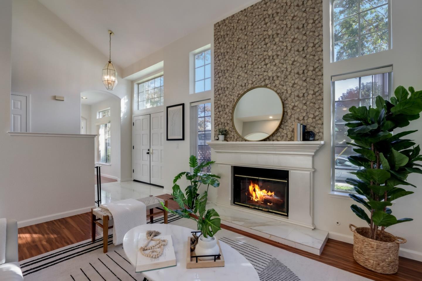 2373 Homestead Road Santa Clara, CA 95050 - Photo 4 of 30 a living room with furniture and a fireplace