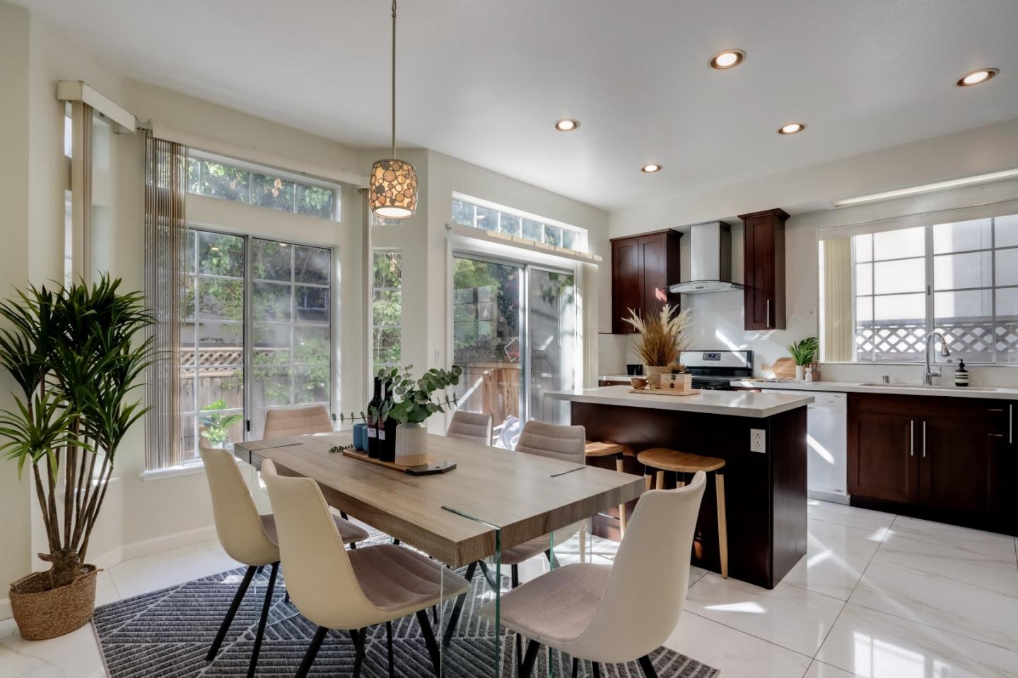 2373 Homestead Road Santa Clara, CA 95050 - Photo 5 of 30 a kitchen with a table and chairs in it