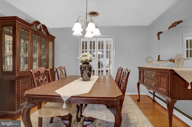 a living room with furniture and a lamp