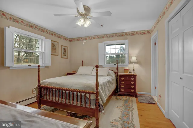 a bedroom with furniture and a window