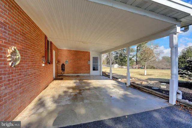 a front view of a house with yard patio and fire pit