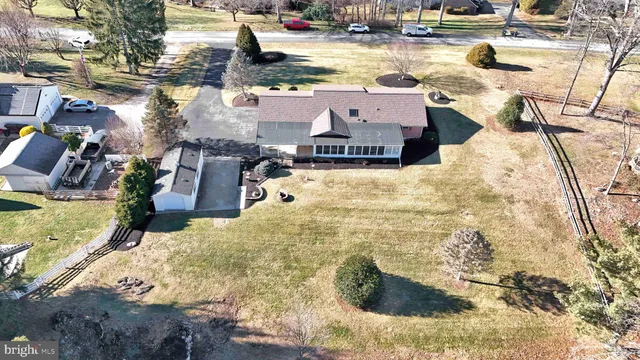 a view of house with yard