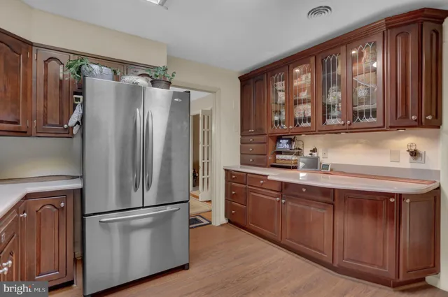 a kitchen with stainless steel appliances a refrigerator and a sink