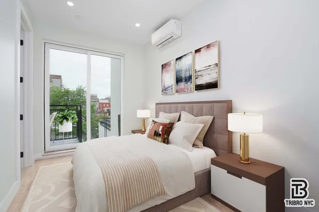 a bedroom with a large bed and a window