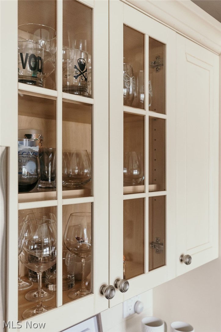 Glass-fronted display cabinets on some uppers in the kitchen.