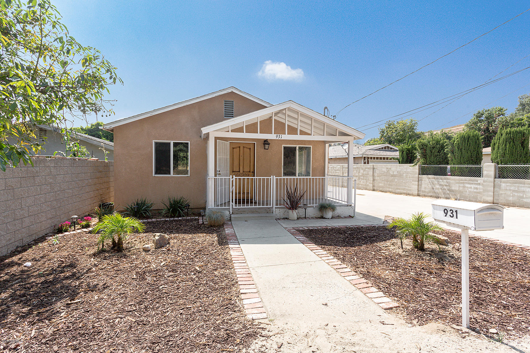 931 Walnut Canyon Road Moorpark, CA 93021 - Photo 1 of 27 a front view of a house with a porch