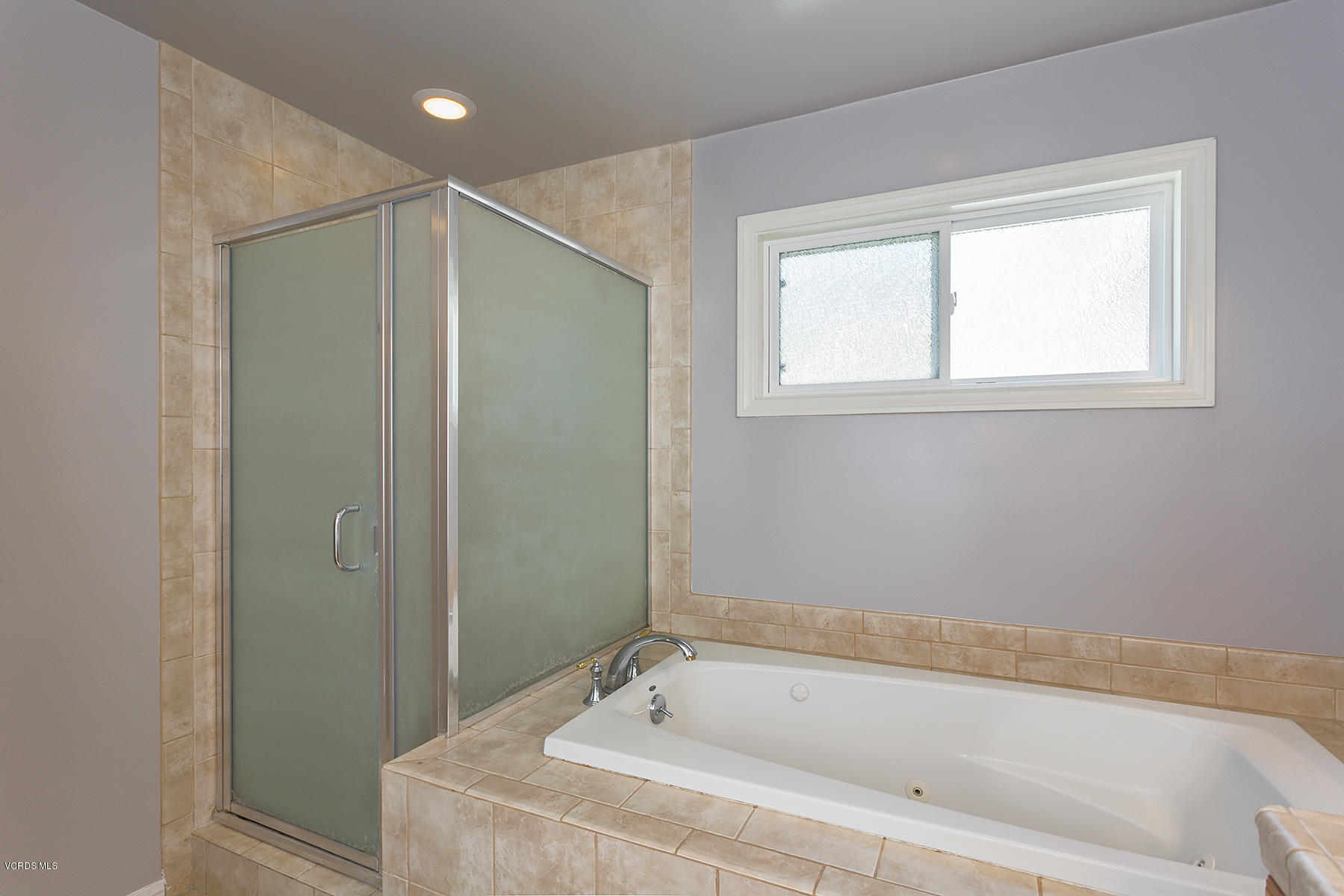 931 Walnut Canyon Road Moorpark, CA 93021 - Photo 13 of 27 a bathroom with a bathtub and a shower