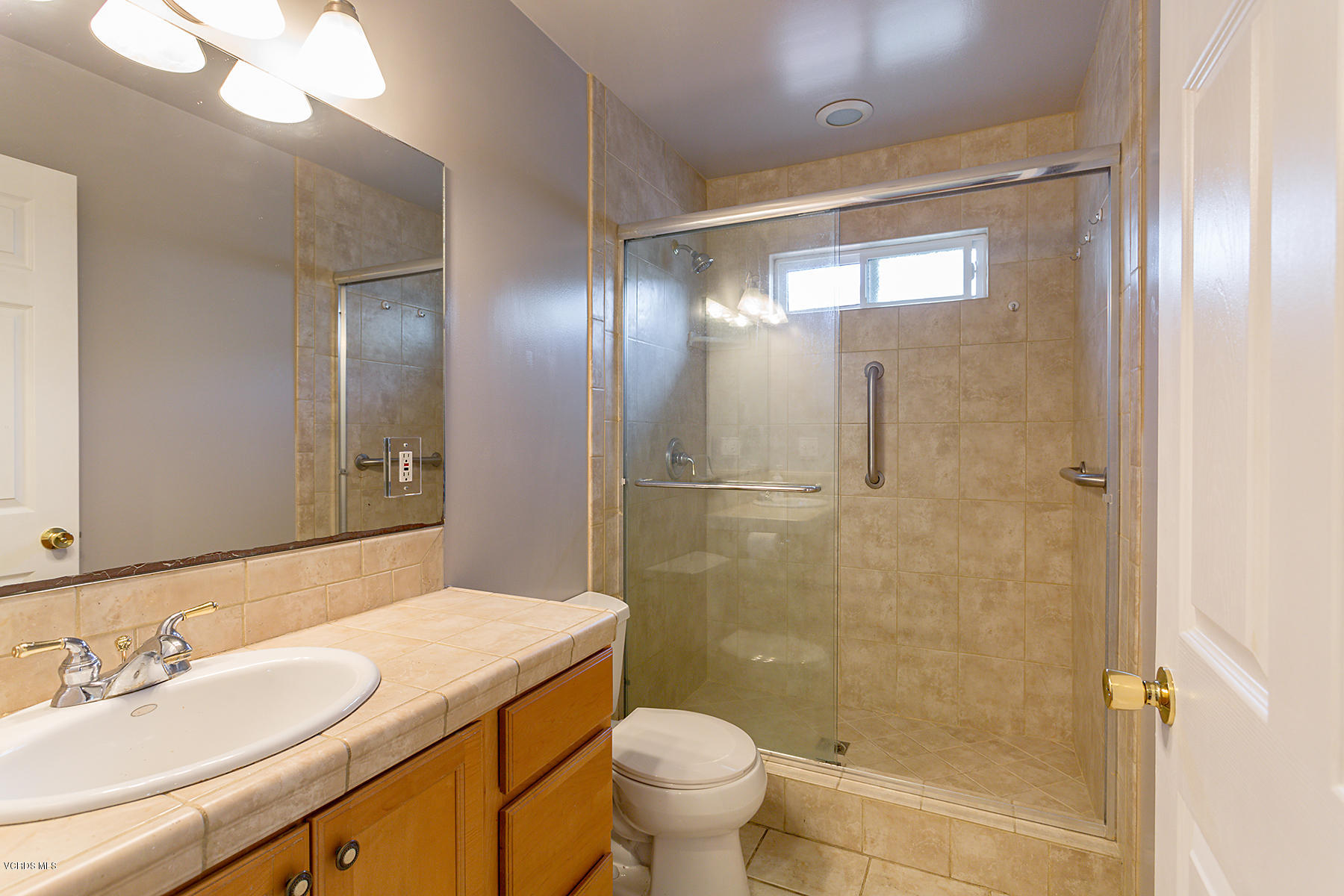 931 Walnut Canyon Road Moorpark, CA 93021 - Photo 18 of 27 a bathroom with a sink a toilet and shower