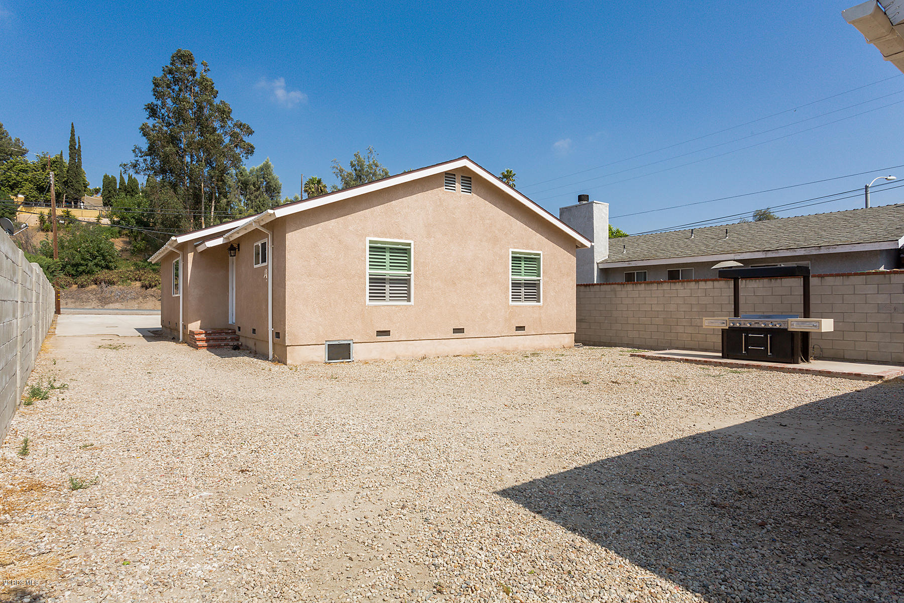 931 Walnut Canyon Road Moorpark, CA 93021 - Photo 23 of 27 a view of a house with a backyard