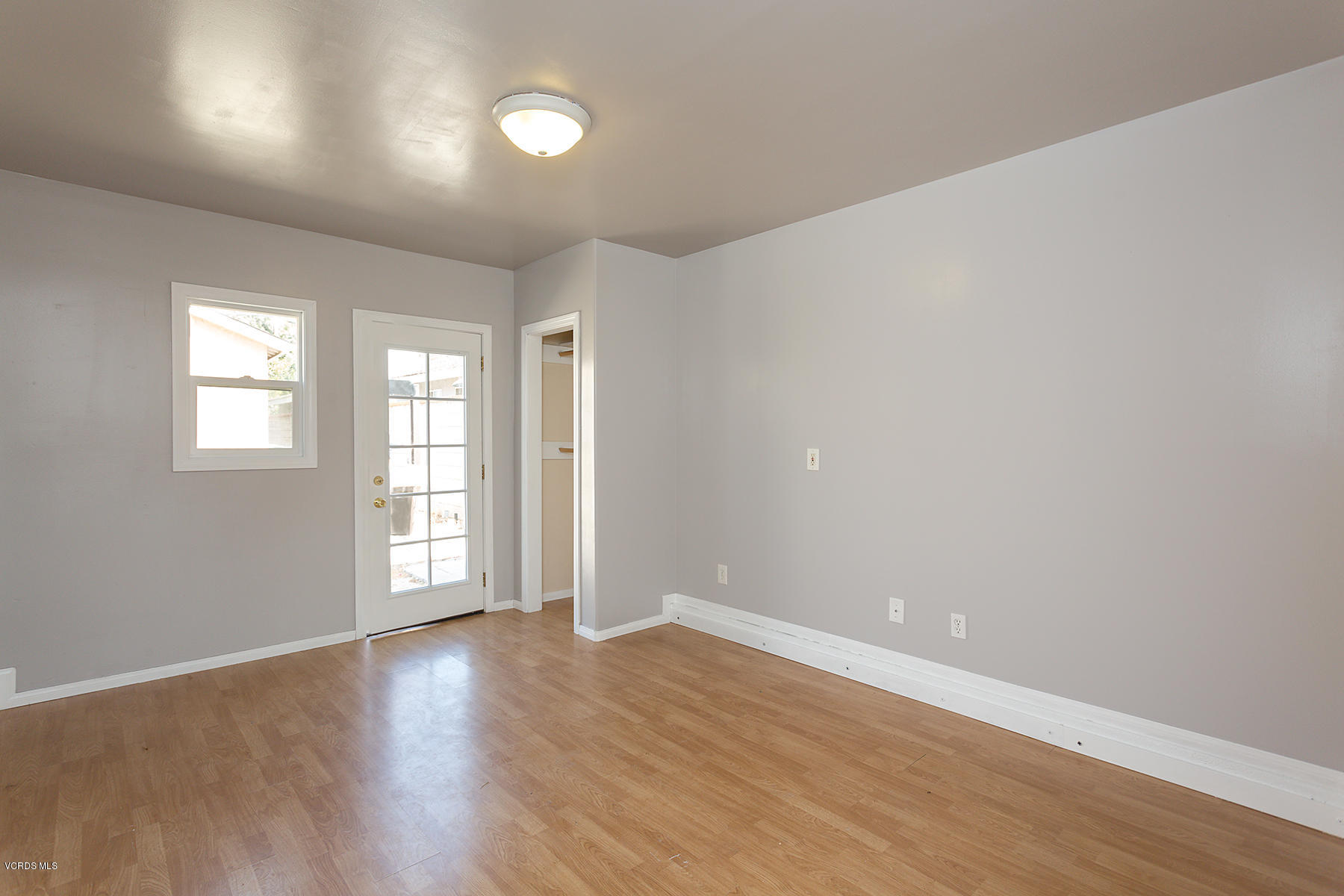 931 Walnut Canyon Road Moorpark, CA 93021 - Photo 26 of 27 wooden floor in an empty room with a window