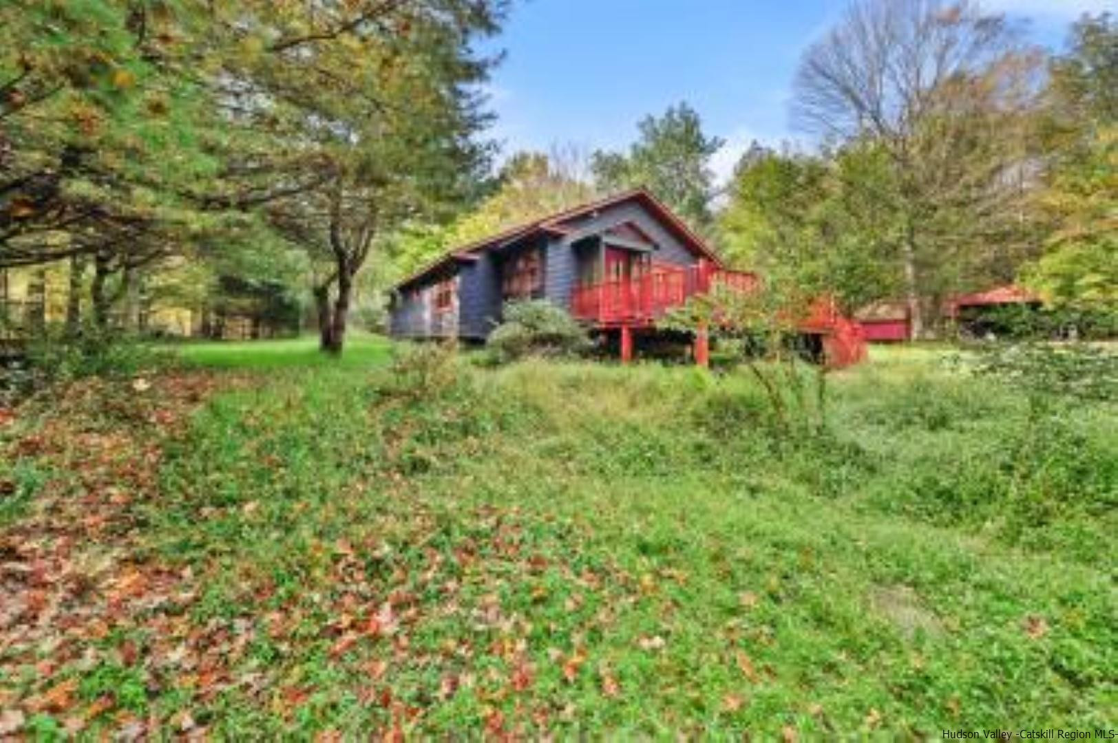 344 Scarawan Road Stone Ridge, NY 12484 - Photo 22 of 30 a front view of a house with yard and tree
