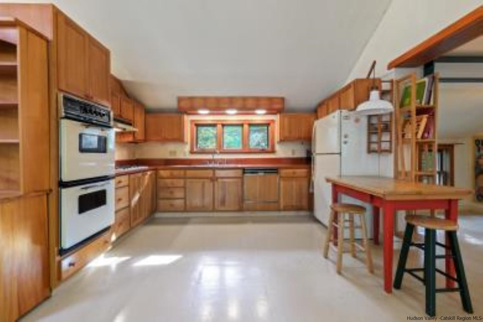 344 Scarawan Road Stone Ridge, NY 12484 - Photo 6 of 30 a kitchen with stainless steel appliances granite countertop a stove a sink and a refrigerator