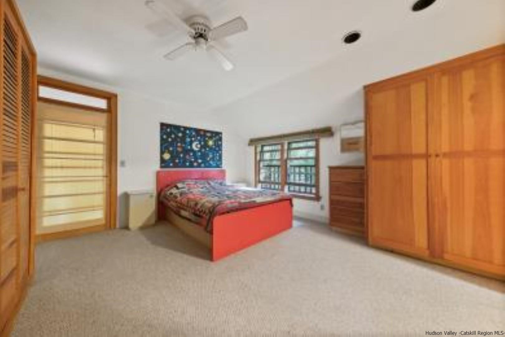 344 Scarawan Road Stone Ridge, NY 12484 - Photo 8 of 30 a spacious bedroom with a bed and a window