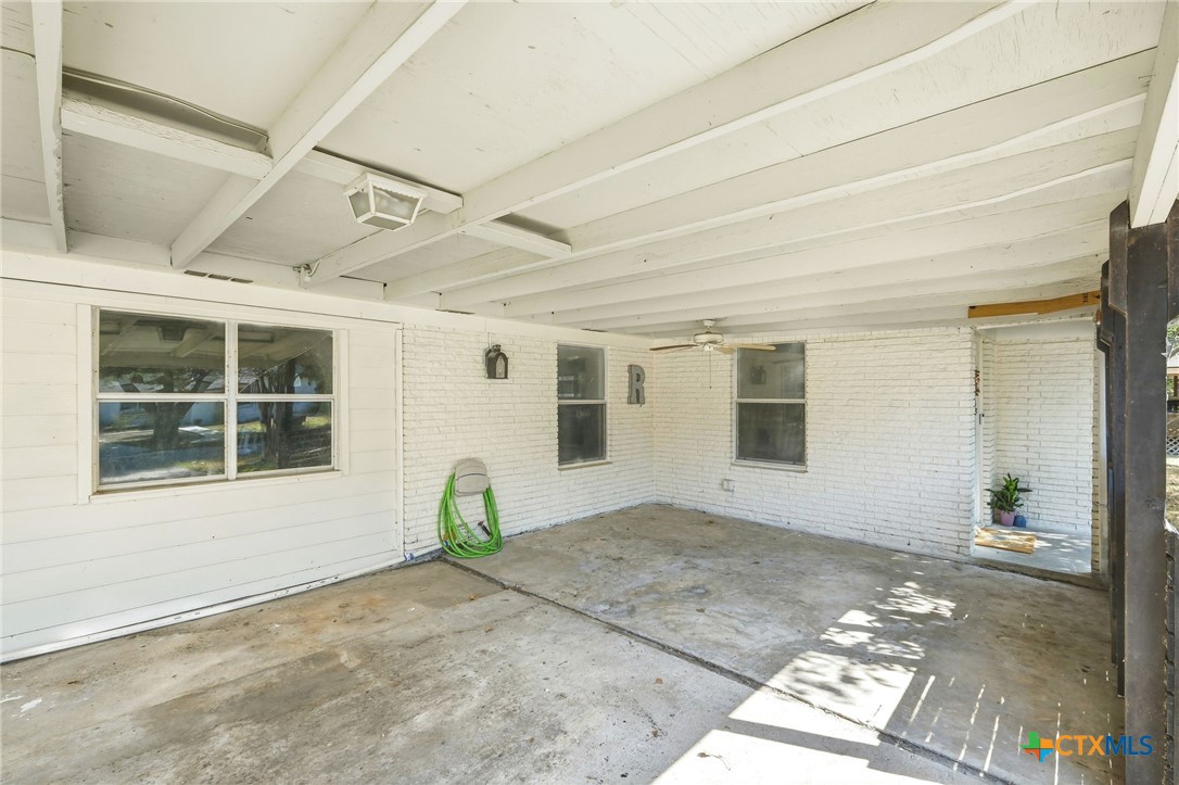 904 Kirk Street Taylor, TX 76574 - Photo 4 of 25 Carport/Patio Area