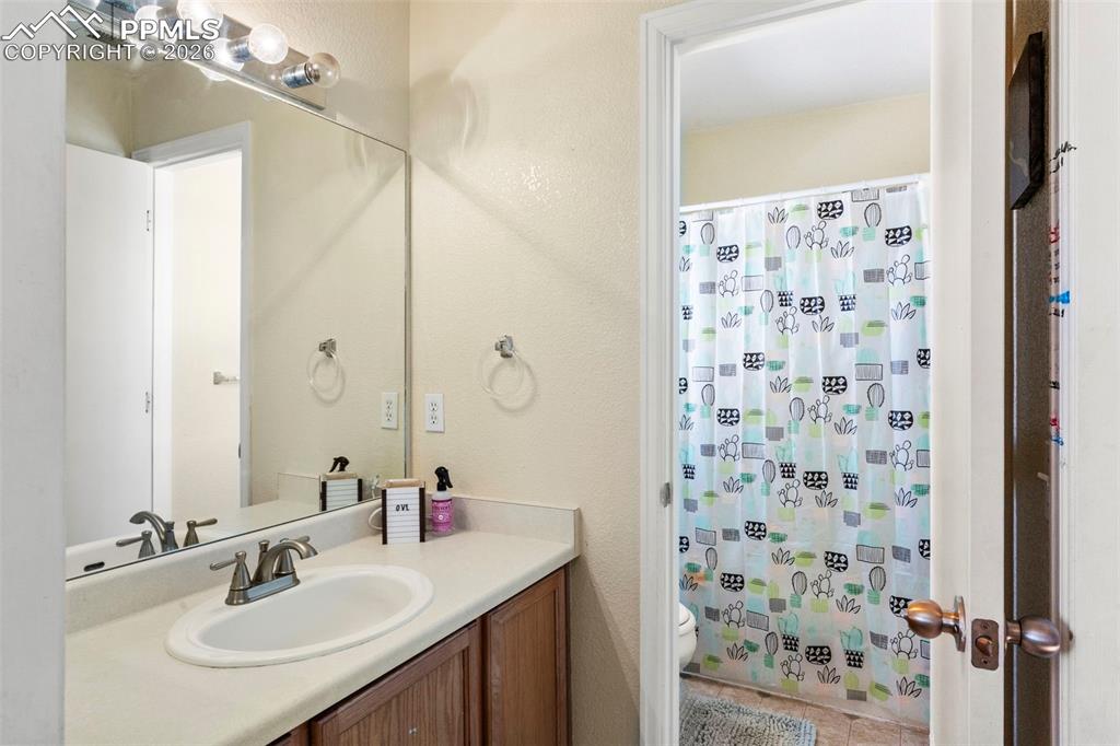 7509 Sistine Lane Fountain, CO 80817 - Photo 15 of 22 a bathroom with a sink shower and a mirror