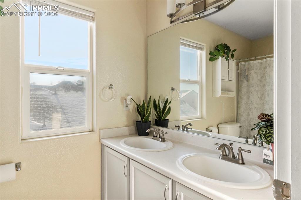 7509 Sistine Lane Fountain, CO 80817 - Photo 20 of 22 a bathroom with a sink and a mirror