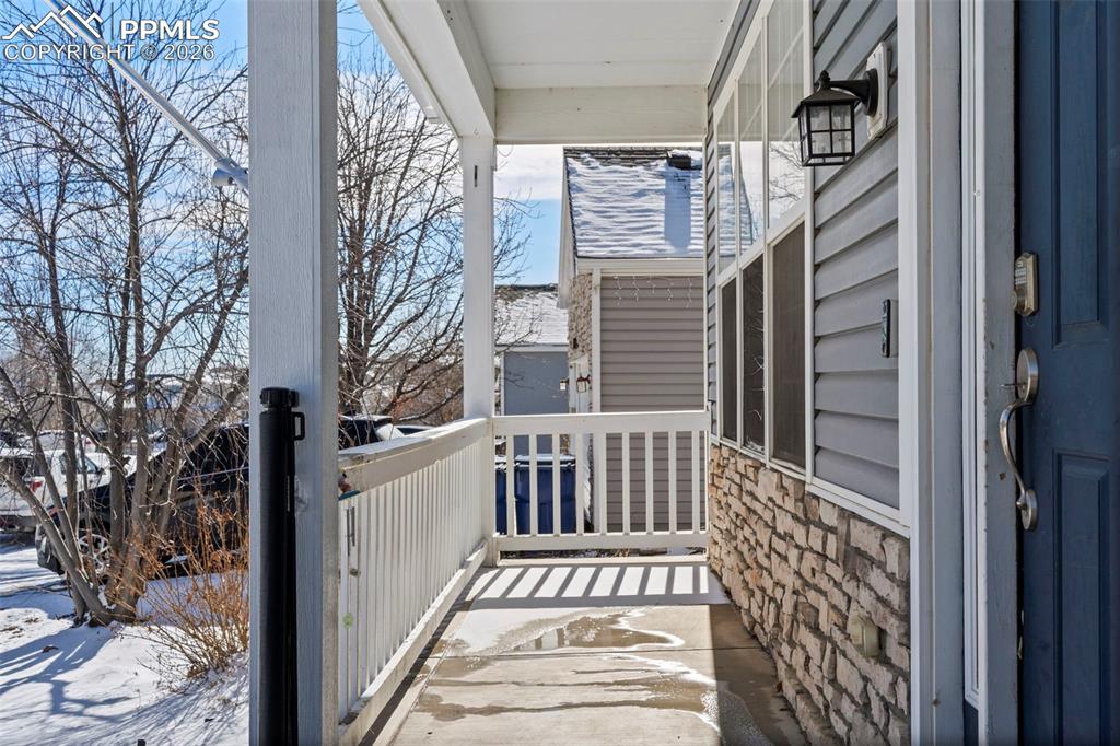 7509 Sistine Lane Fountain, CO 80817 - Photo 2 of 22 a view of a balcony with wooden floor and outdoor seating