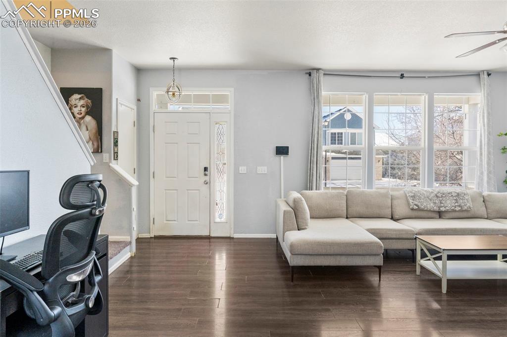 7509 Sistine Lane Fountain, CO 80817 - Photo 5 of 22 a living room with furniture a window and wooden floor