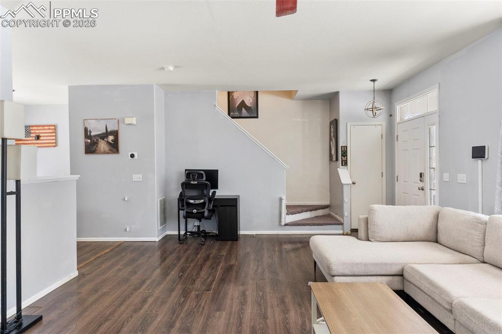 7509 Sistine Lane Fountain, CO 80817 - Photo 6 of 22 a living room with furniture and a wooden floor