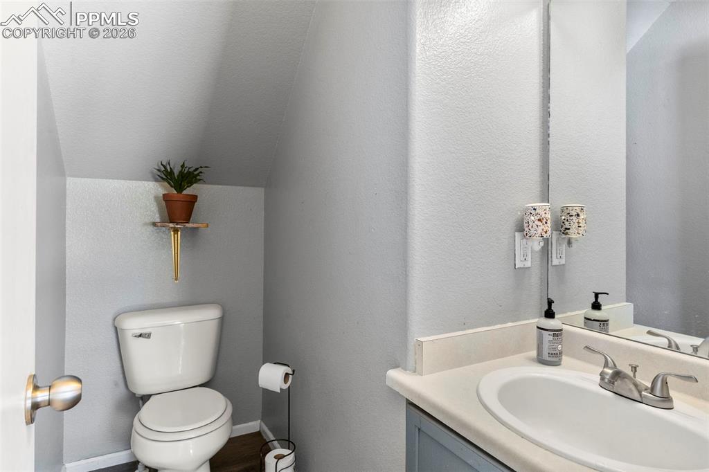 7509 Sistine Lane Fountain, CO 80817 - Photo 8 of 22 a bathroom with a toilet sink and mirror