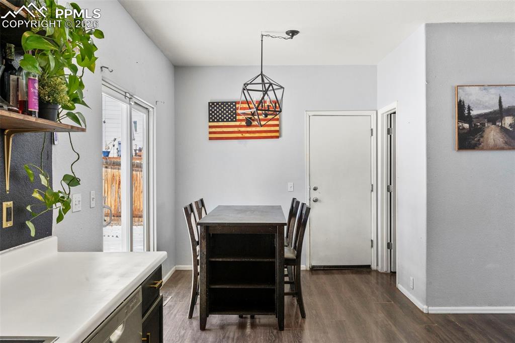 7509 Sistine Lane Fountain, CO 80817 - Photo 10 of 22 a view of a dining room with furniture window and wooden floor