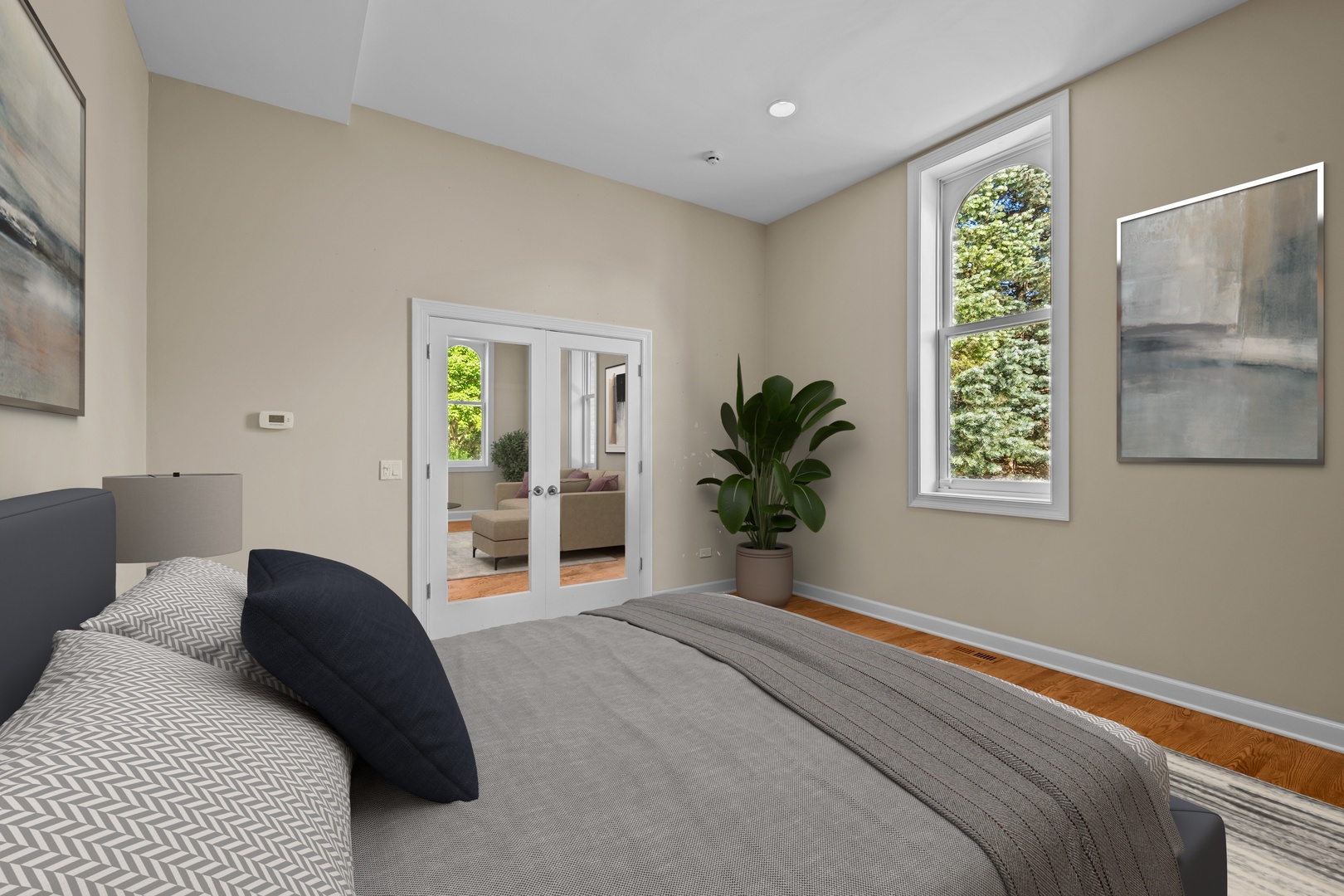 738 Lyster Road Highwood, IL 60040 - Photo 8 of 16 a bedroom with a bed and a potted plant