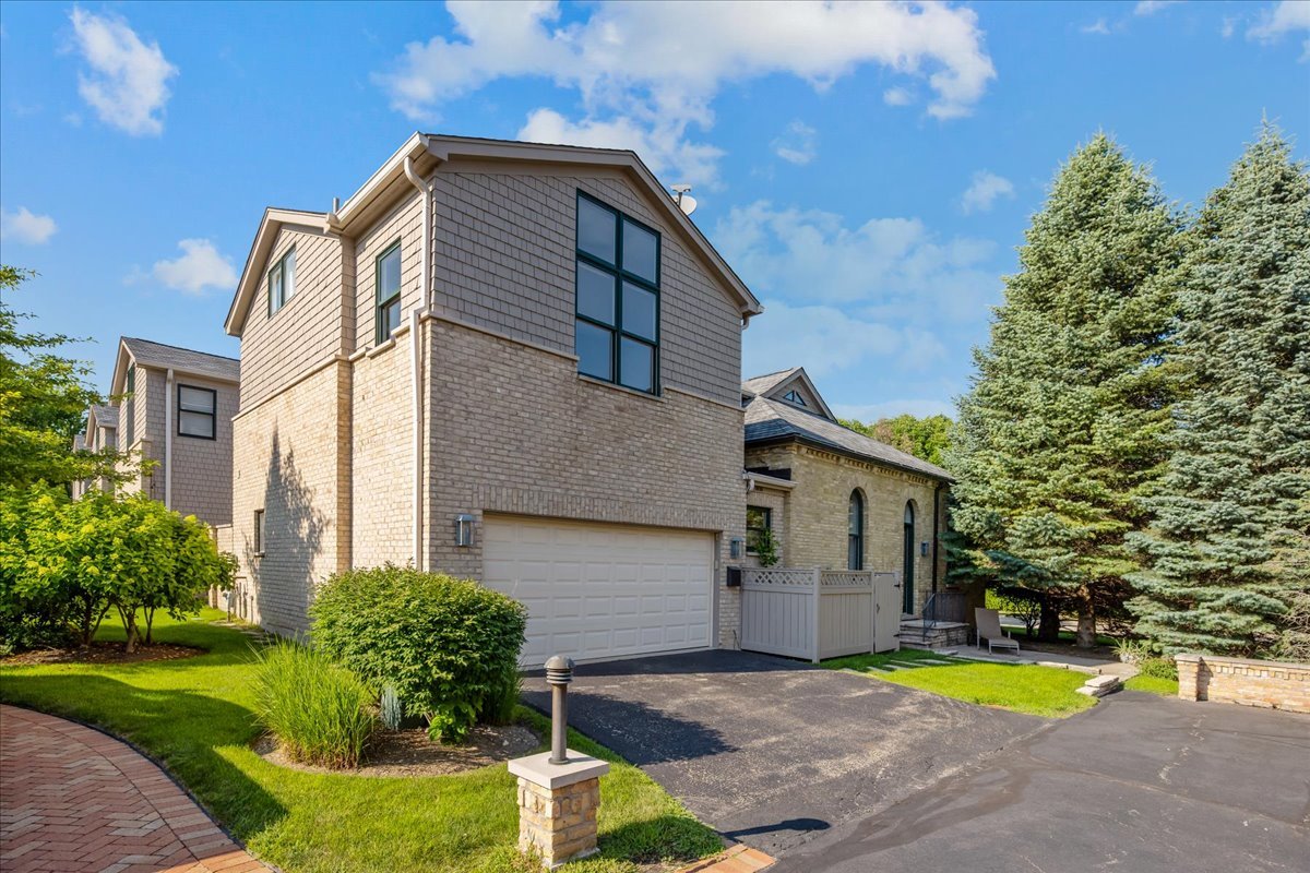 738 Lyster Road Highwood, IL 60040 - Photo 12 of 16 a front view of a house with a garden and swimming pool