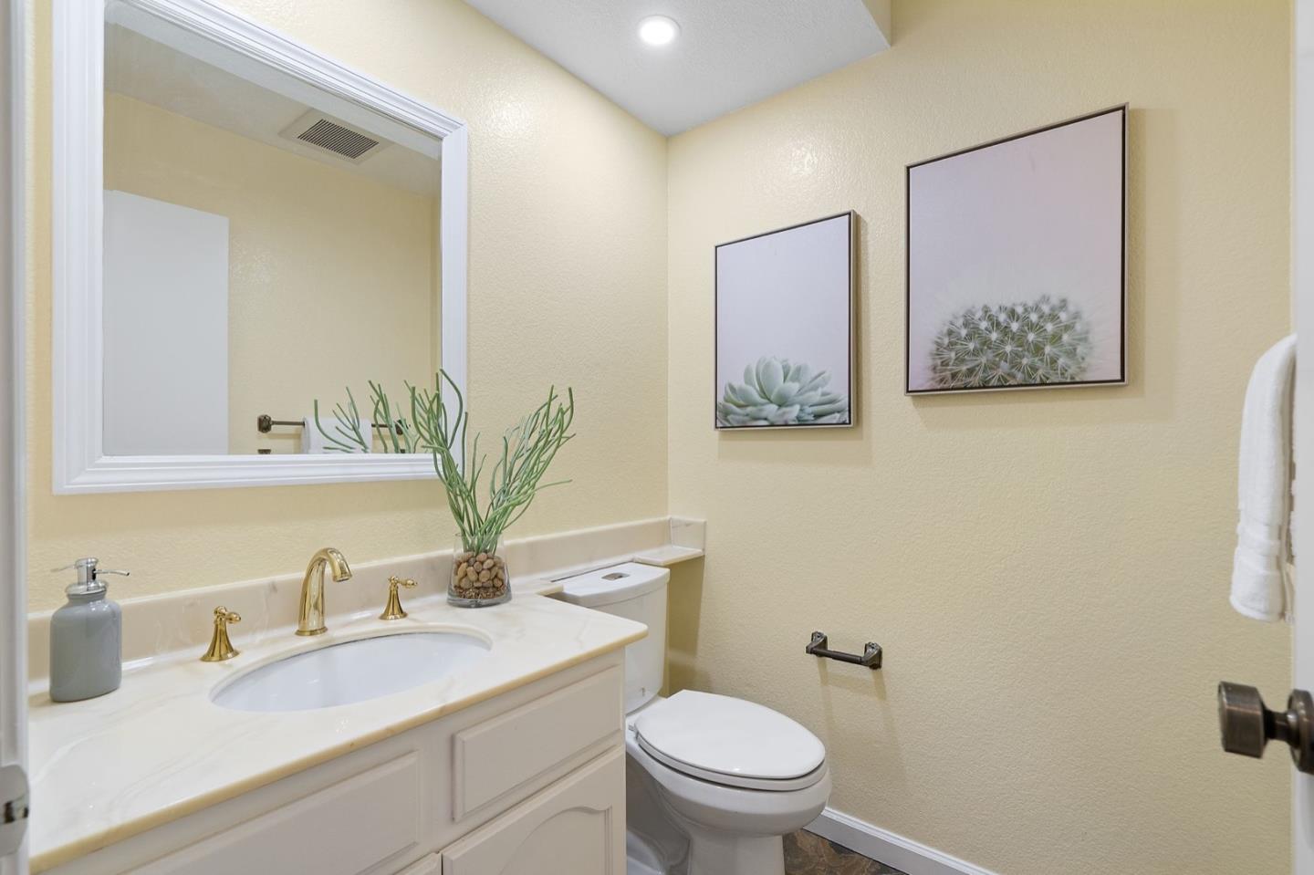229 Michigan Road Milpitas, CA 95035 - Photo 30 of 38 a bathroom with a granite countertop sink mirror and toilet