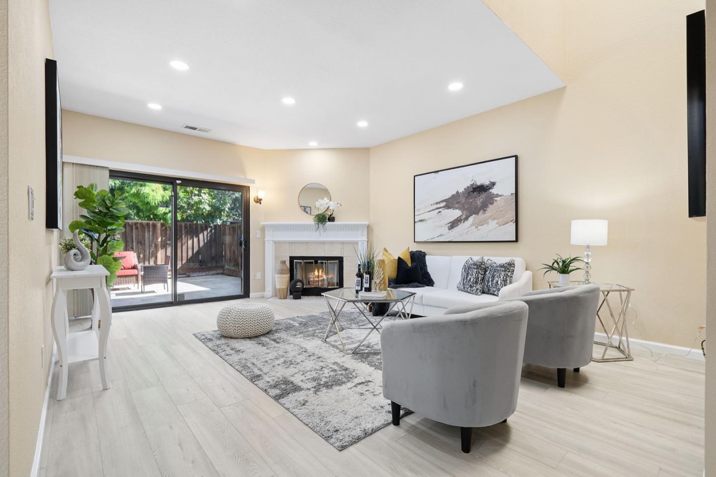 229 Michigan Road Milpitas, CA 95035 - Photo 4 of 38 a living room with furniture a fireplace and a floor to ceiling window