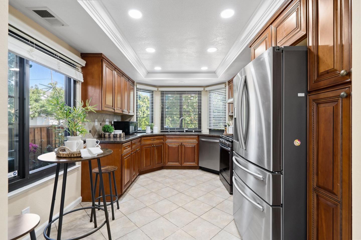 229 Michigan Road Milpitas, CA 95035 - Photo 6 of 38 a kitchen with stainless steel appliances granite countertop a refrigerator and a stove top oven