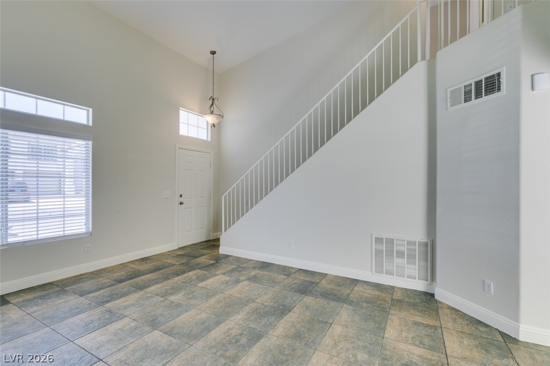 200 Luninborg Street Henderson, NV 89074 - Photo 33 of 40 The soaring ceilings and expansive tiled floor create an airy and welcoming entry.