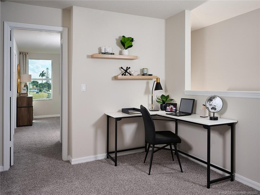 5680 Southeast Edgewater Circle Stuart, FL 34997 - Photo 7 of 8 a view of a workspace with furniture