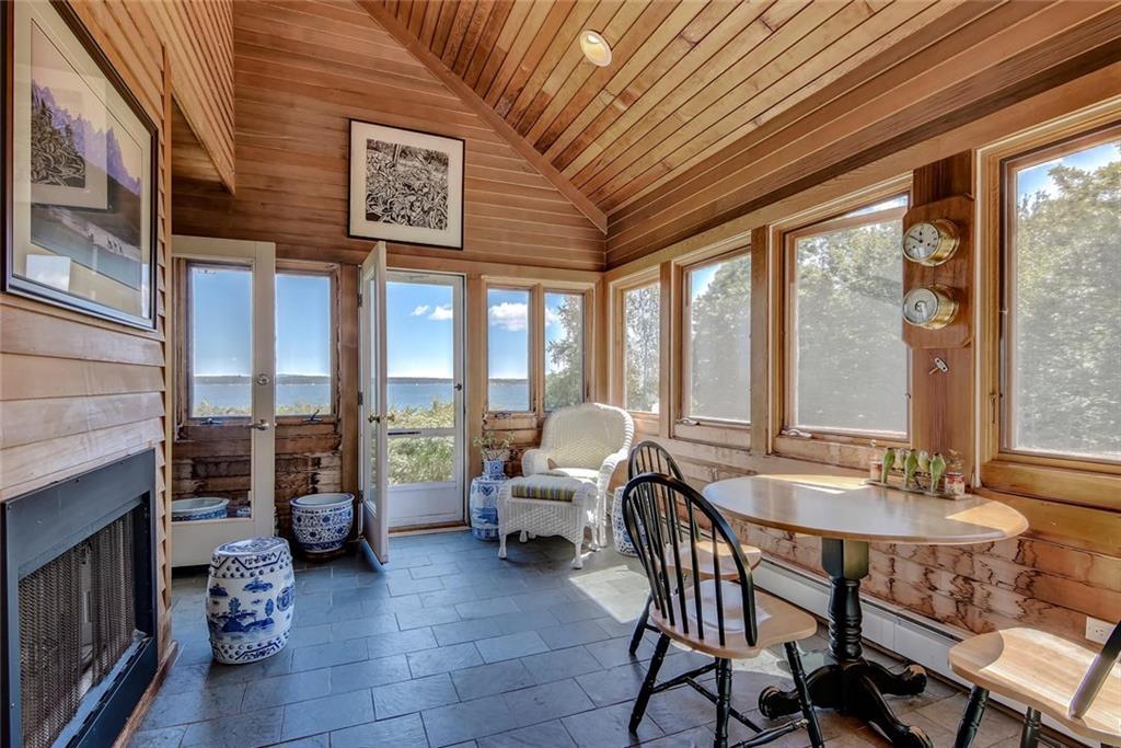 536 Reach Road Deer Isle, ME 04627 - Photo 17 of 33 Wood paneled sunroom with wood...
