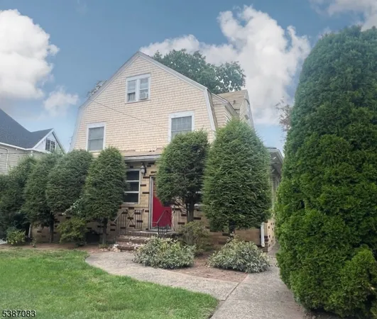 a view of a house with yard and garden