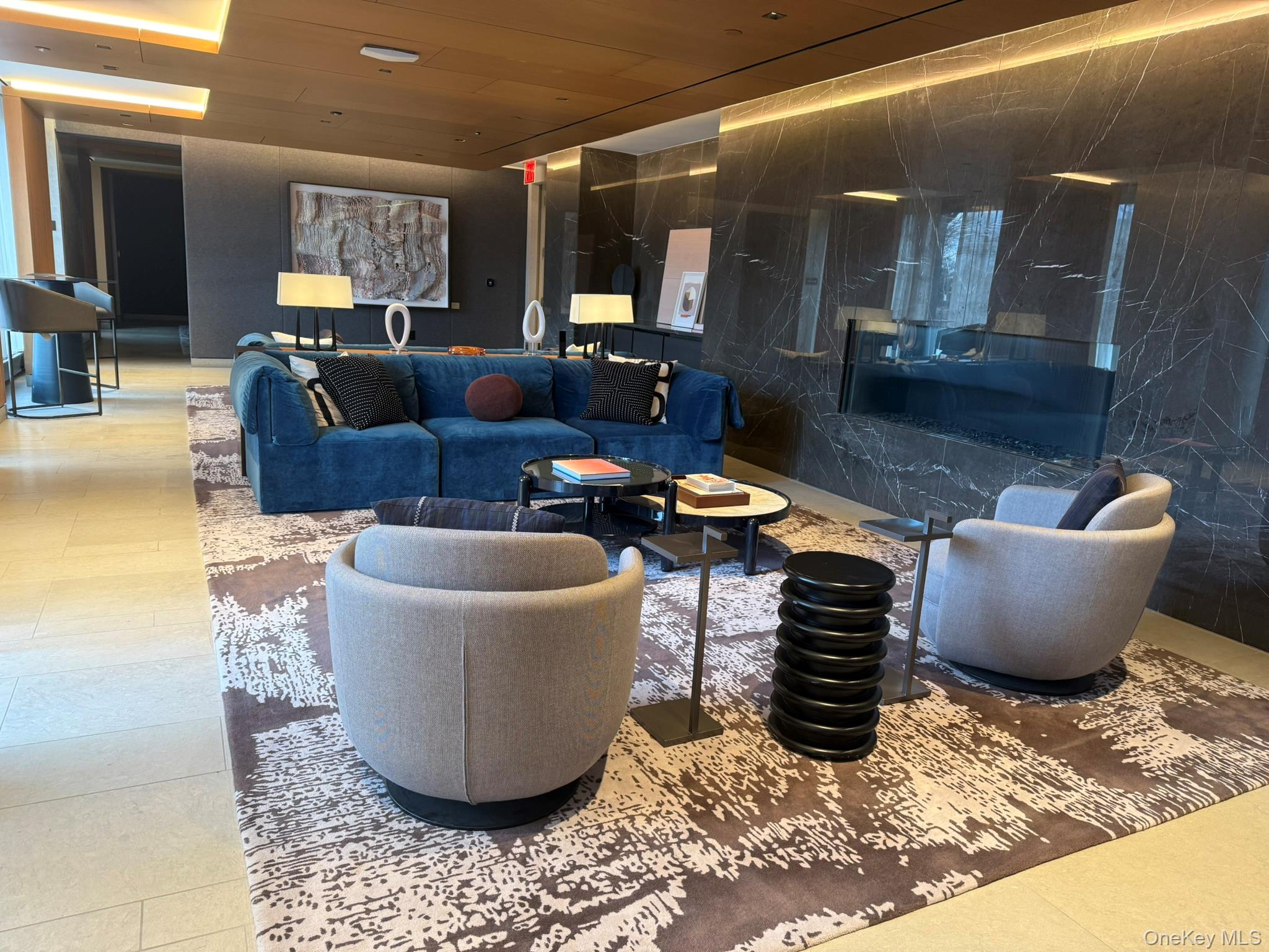 450 Washington Street, Unit 306 Manhattan, NY 10013 - Photo 16 of 33 a living room with furniture a rug and kitchen view