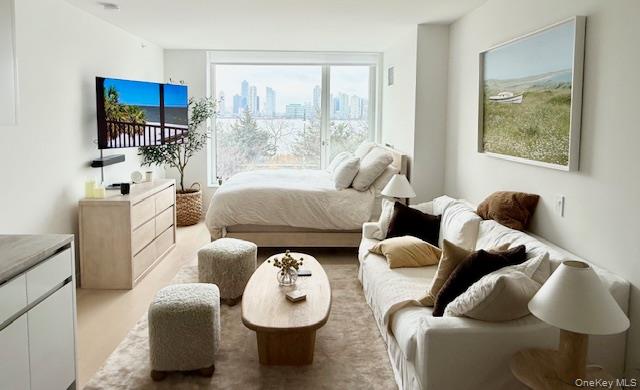 450 Washington Street, Unit 306 Manhattan, NY 10013 - Photo 2 of 33 a living room with furniture and a large window