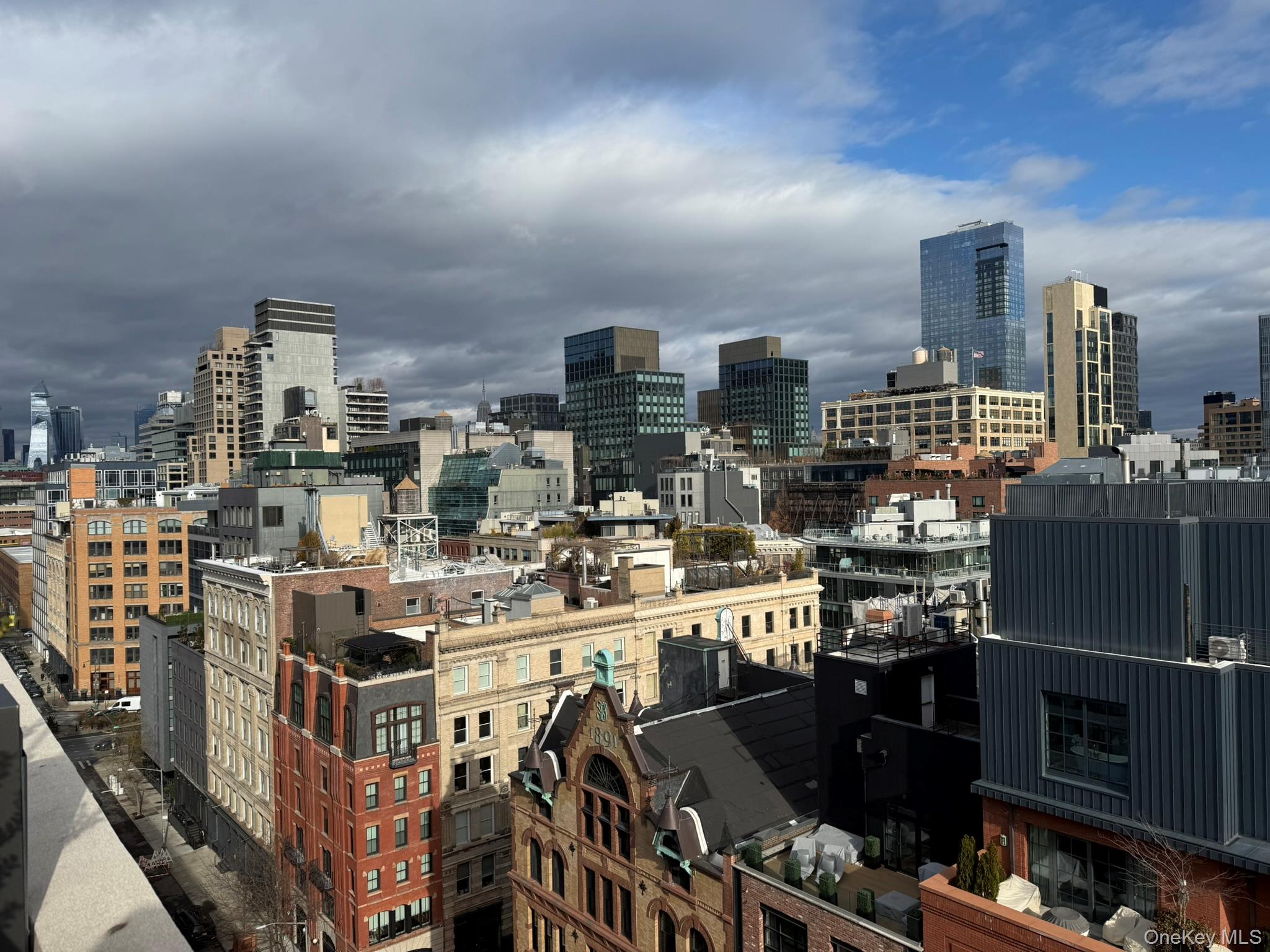 450 Washington Street, Unit 306 Manhattan, NY 10013 - Photo 32 of 33 a view of a city from a chairs and tables