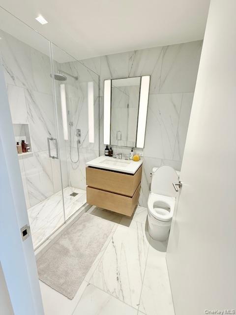 450 Washington Street, Unit 306 Manhattan, NY 10013 - Photo 7 of 33 a bathroom with a sink toilet and shower