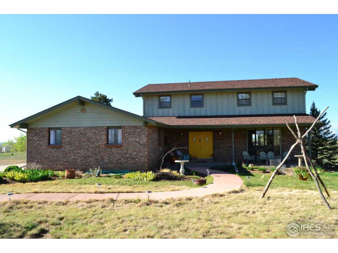 10107 Phillips Road Lafayette, CO 80026 - Photo 1 of 22 a house view with a backyard space