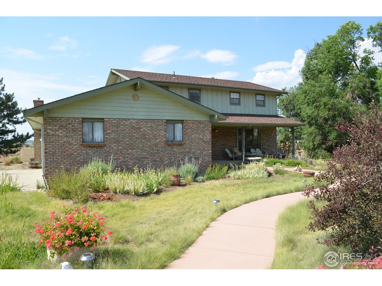 10107 Phillips Road Lafayette, CO 80026 - Photo 2 of 22 a front view of a house with a yard