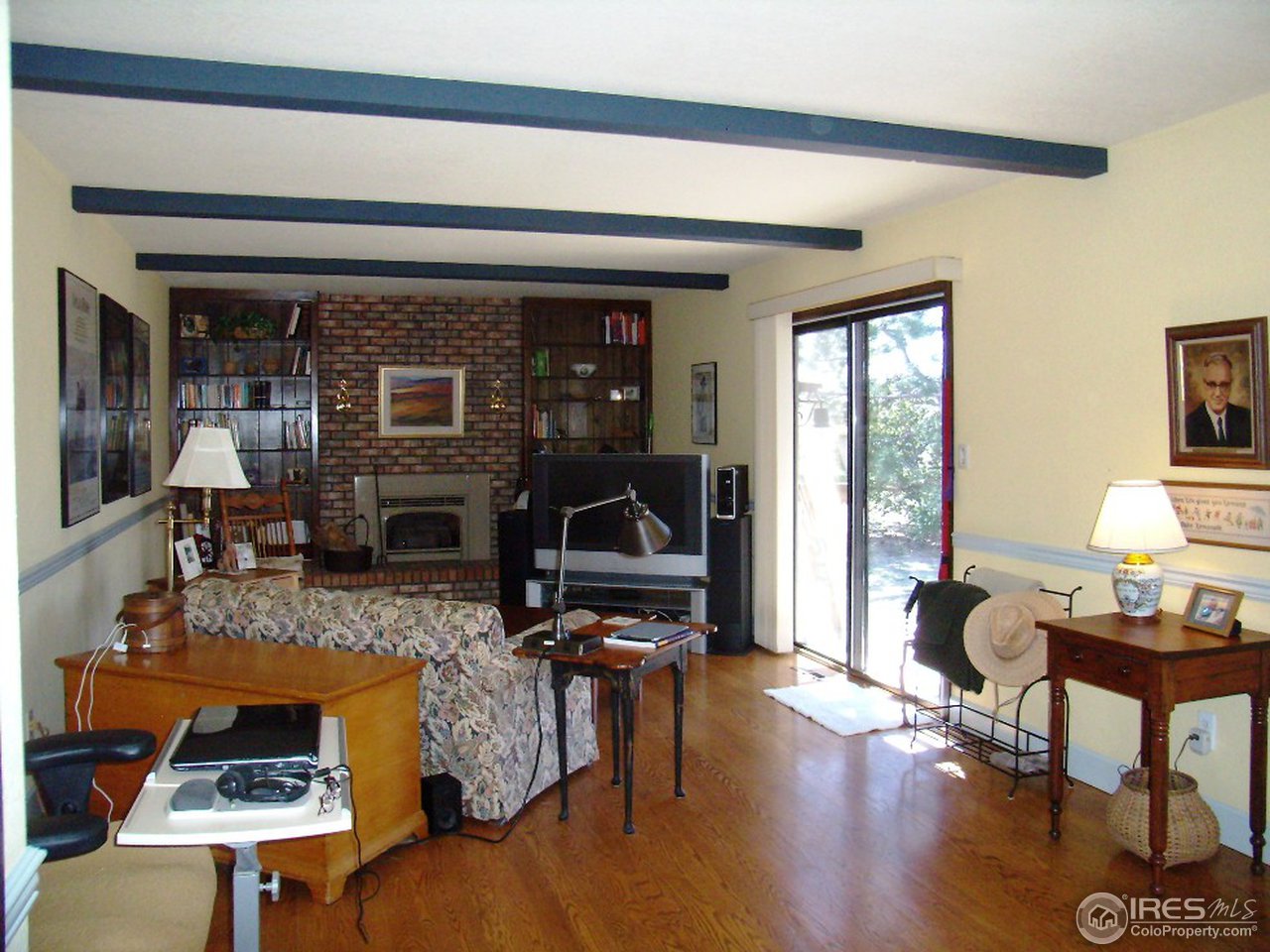 10107 Phillips Road Lafayette, CO 80026 - Photo 10 of 22 a living room with furniture and a floor to ceiling window