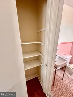 a storage room with wooden floor