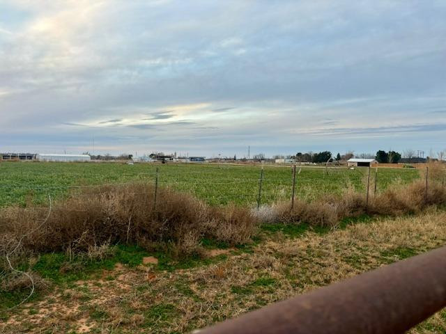 1014 Old Lamesa Road Brownfield, TX 79316 - Photo 9 of 13 a view of a lake from a yard