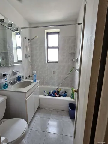 a bathroom with a sink a toilet and a bathtub