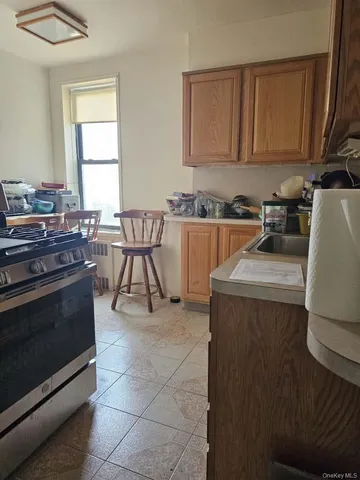 a kitchen with a stove and a microwave