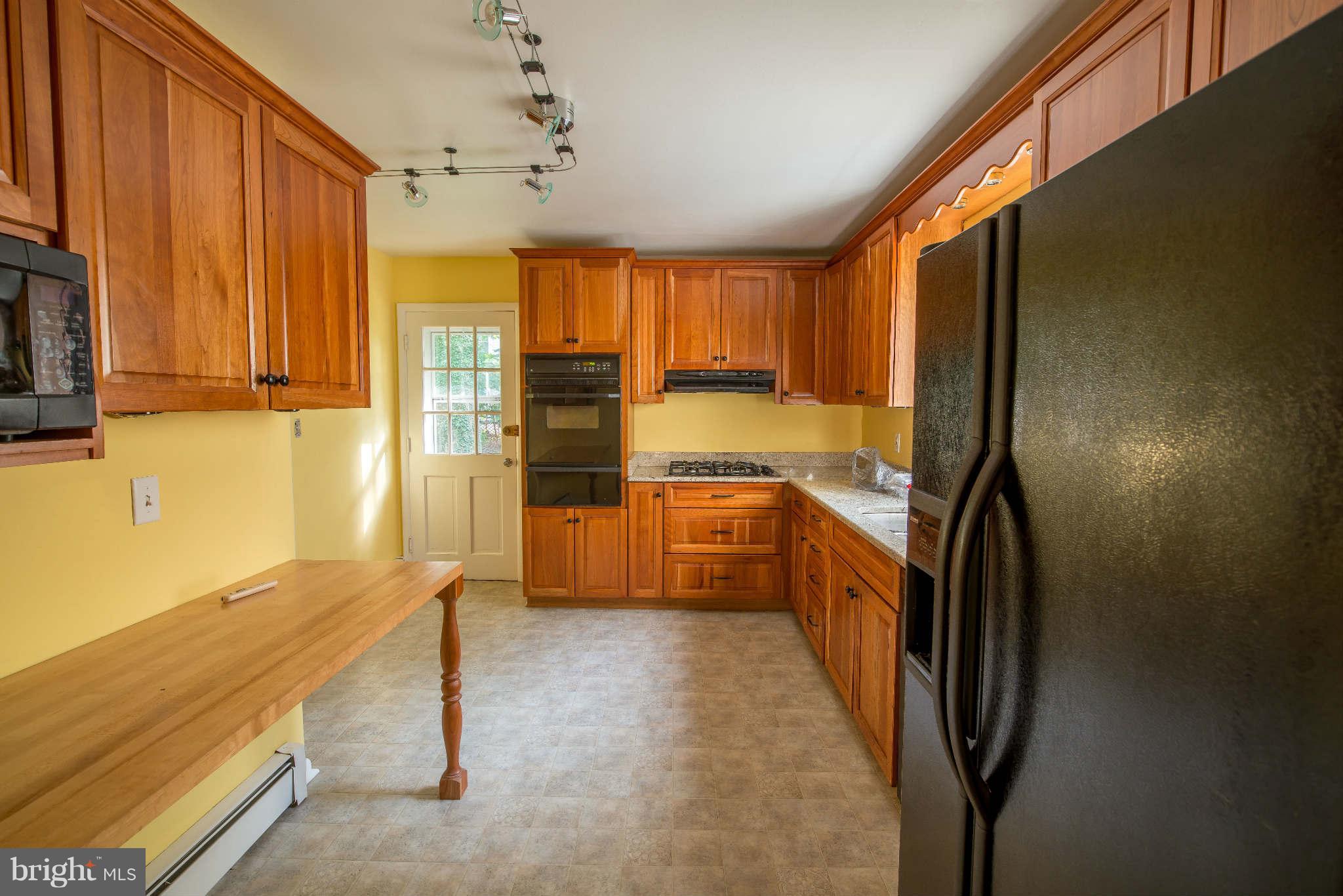 5 Beechdale Road Baltimore, MD 21210 - Photo 5 of 20 a kitchen with stainless steel appliances granite countertop a refrigerator and a sink
