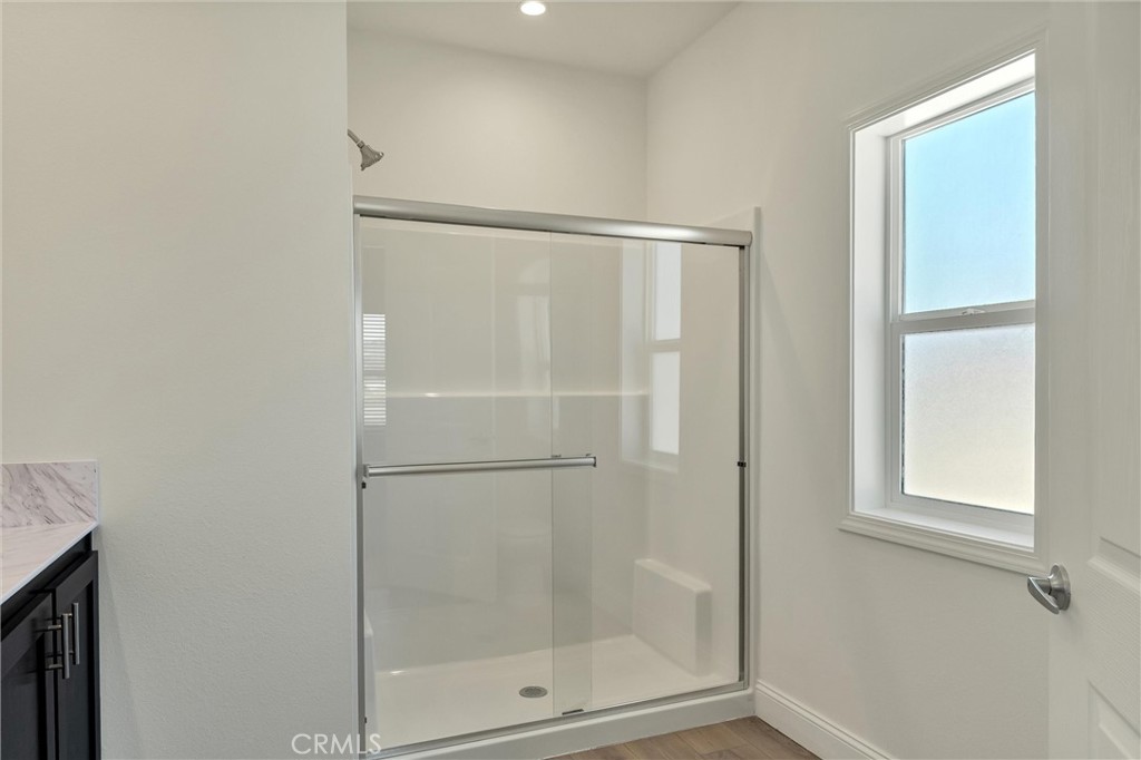 4333 Pentz Road, Unit 30 Paradise, CA 95969 - Photo 29 of 29 a bathroom with a glass shower door